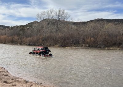 SUV crossing river